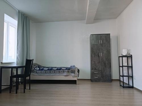 Postel nebo postele na pokoji v ubytování Nomad Inn