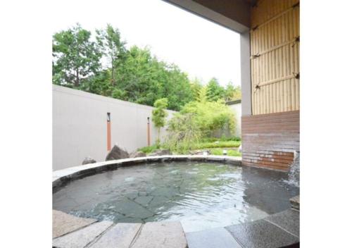 a pool in the backyard of a house at Isawa no sato / Vacation STAY 61566 in Shiso