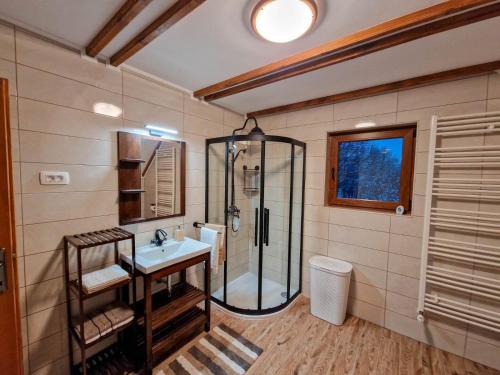 a bathroom with a shower and a sink at Holiday home Marta in nature with jacuzzi in Gospić