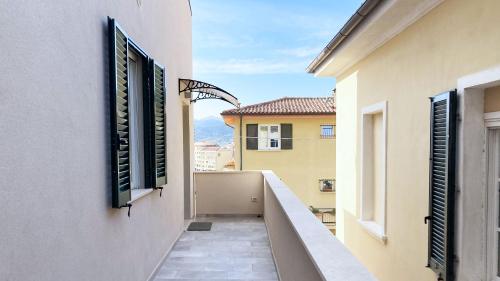 a balcony with a view of a building at Falconetta Luxury House in Portoferraio