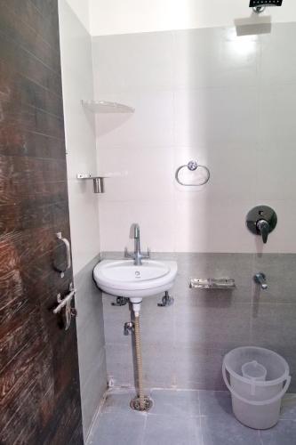a bathroom with a sink and a toilet at HOTEL IRA Mansarovar Jaipur in Jaipur