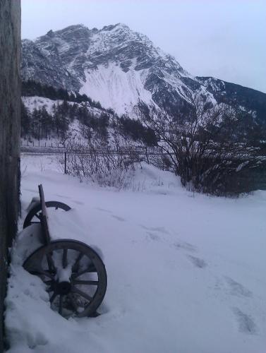 a snow covered mountain in front of a snow coveredokedokedoked at Guesthouse Seghetto in Valdidentro