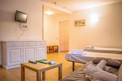 Cama o camas de una habitación en Estudis Turístics Cims Pas 3000