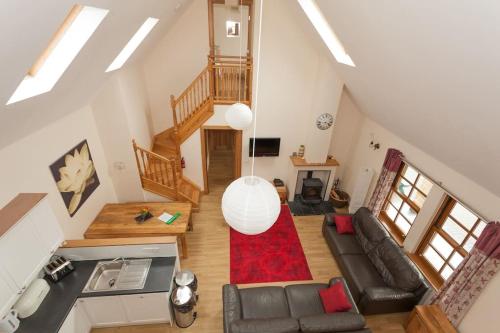 an overhead view of a living room with a couch at Appletree Cottage at Williamscraig Holiday Cottages in Linlithgow
