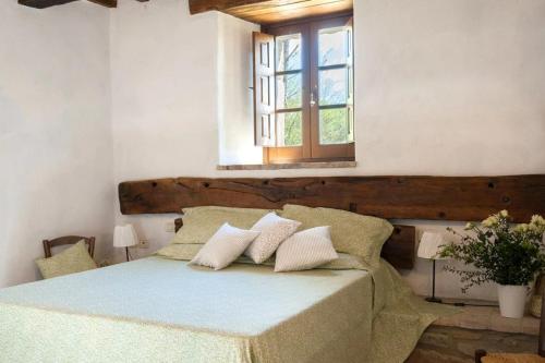 En eller flere senge i et værelse på Appartamento Stalla - Cortona
