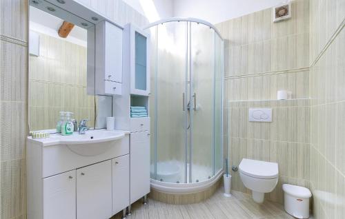 a bathroom with a shower and a toilet and a sink at Nice Apartment In Fazana With 2 Bedrooms in Fažana