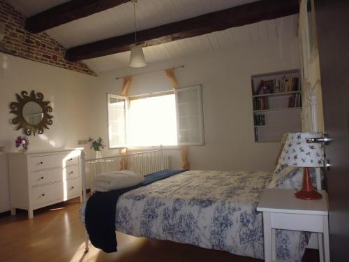 a bedroom with a bed and a window at Ca del Lago Misano in Misano Adriatico