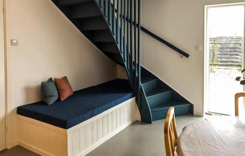 a room with a bench under a staircase at Stunning Home In Sölvesborg With Wifi in Sölvesborg
