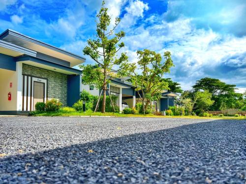 a house with a road in front of it at Blue Moon Boutique Resort in Sichon