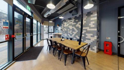 a dining room with a wooden table and chairs at Twerton Mill in Bath 7 Min Bus to City Centre in Bath