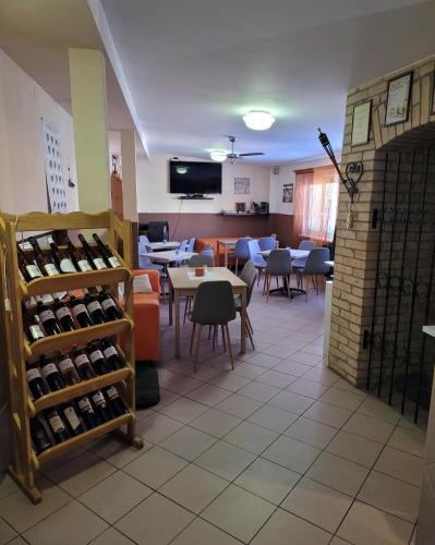 a restaurant with a room filled with bottles of wine at Penzion Miromar in Podivín