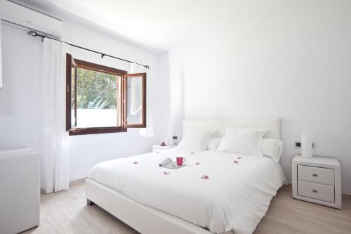 Cama ou camas em um quarto em Santerra - San Jose