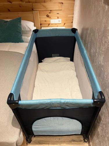 a small bed in a small room with a mattress at Alpenburg Bergparadies Apartments in Wald am Arlberg