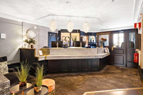 a large bathroom with a large tub in a room at Best Western Motala Stadshotell in Motala