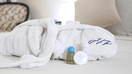 a white towel and some medicines on a table at Hotel Parador in Chefchaouen