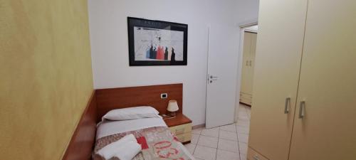 Ένα ή περισσότερα κρεβάτια σε δωμάτιο στο Apartments Tony in Bardolino