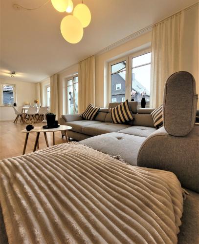 a living room with a couch and a table at Winterberg Appartement 21121 in Winterberg