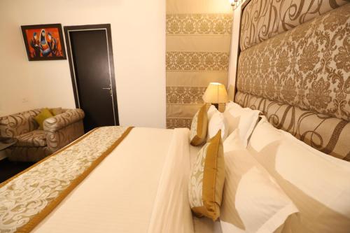 Katil atau katil-katil dalam bilik di Hotel Capitol Hills - Greater Kailash Delhi