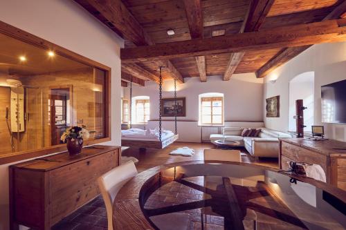 a large living room with a table and a couch at Mill Apartments in Český Krumlov