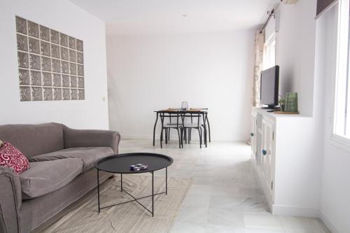 Televízia a/alebo spoločenská miestnosť v ubytovaní Apartamento Albareda Centro