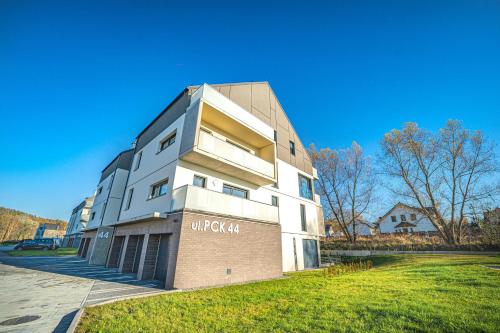 a building with a sign on the side of it at Apartament w Cieplicach 7 Relax in Jelenia Góra