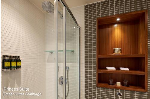a shower in a bathroom with a glass shower stall at Fraser Suites Edinburgh in Edinburgh
