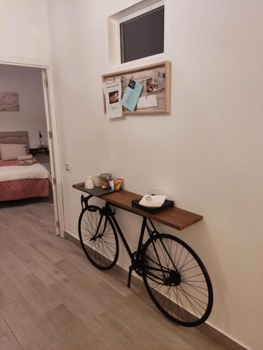 a bike parked in a room with a bedroom at Casa isabel in Setenil