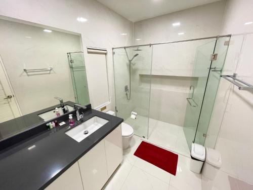 a bathroom with a sink and a glass shower at View Talay Villas, luxury private pool villa, 500m from Jomtien beach - 45 in Jomtien Beach