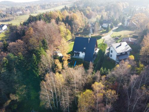 an aerial view of a house in the forest at Villa Vincentów in Myślenice