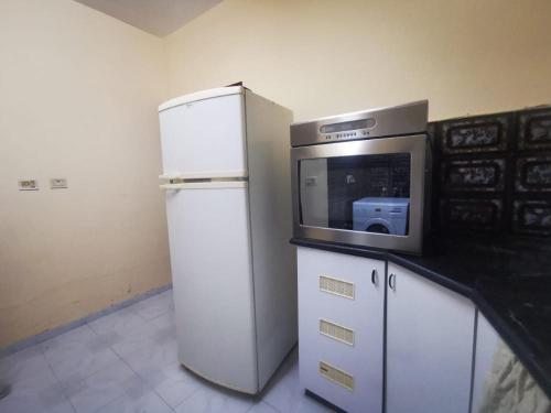 a kitchen with a microwave and a refrigerator at Bethlehem home in Bethlehem