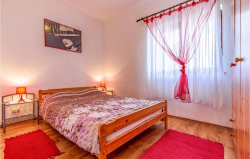 A bed or beds in a room at Beautiful Apartment In Pula With 1 Bedrooms, Wifi And Outdoor Swimming Pool