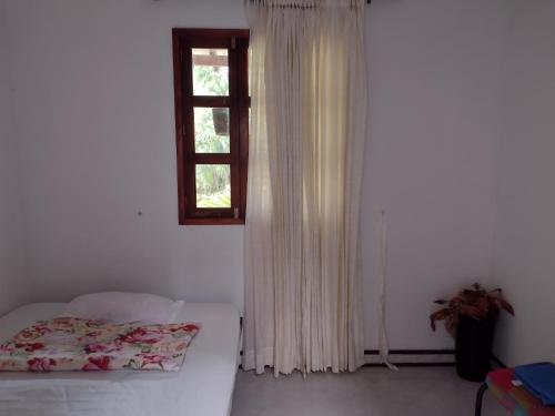 a bedroom with a bed and a window at Ecopolis casa de campo in Papagalleros