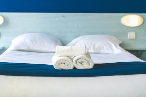 Katil atau katil-katil dalam bilik di Le CESAR HOTEL