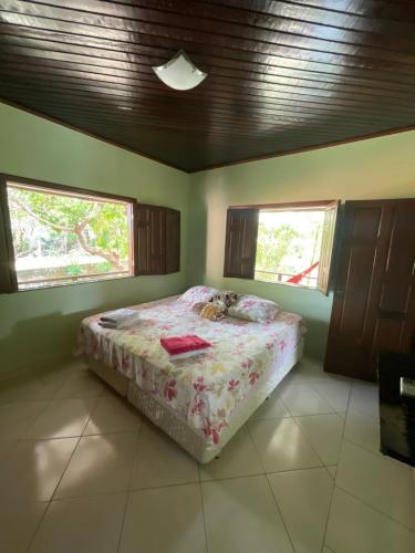 מיטה או מיטות בחדר ב-Casa em Alter do chão - lago verde