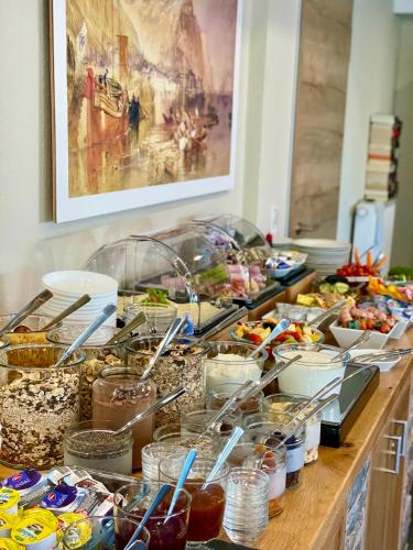 a buffet with many different food items on a table at Weinbergs Loge in Ernst