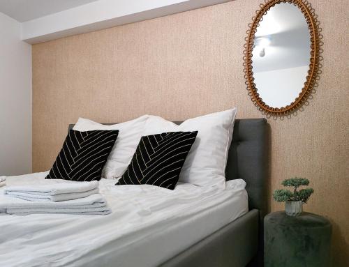 Un pat sau paturi într-o cameră la Apartament pod Tatrami