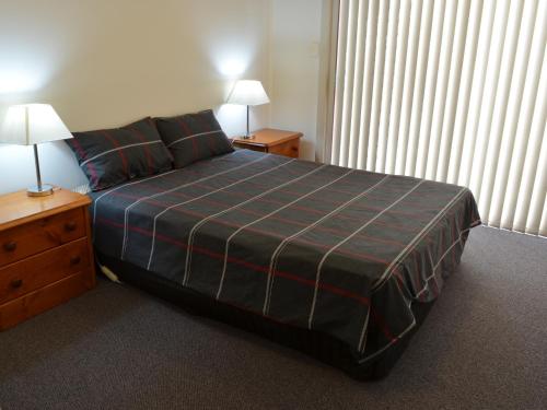 מיטה או מיטות בחדר ב-Freycinet Sands