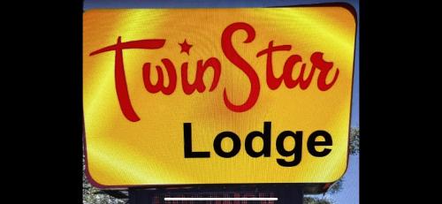 a sign for a new star lodge at Twin Star Lodge in Biloxi