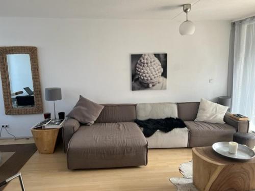 a living room with a couch and a table at center City appartement in Alphen aan den Rijn