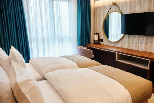 Postel nebo postele na pokoji v ubytování Hotel Zlatibor