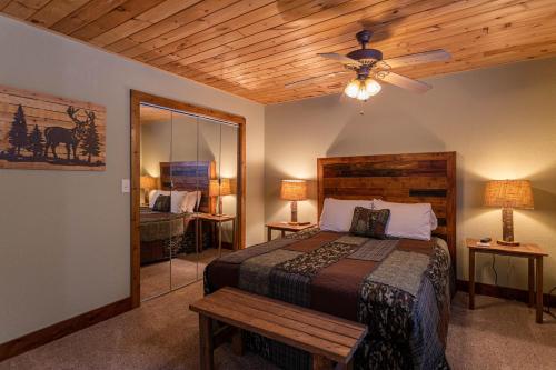 a bedroom with a bed and a ceiling fan at Grand Panorama in Banner Elk