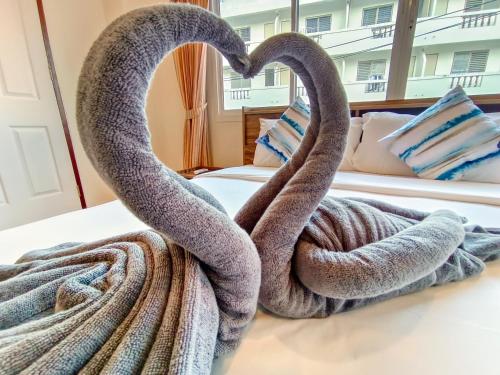 Ένα ή περισσότερα κρεβάτια σε δωμάτιο στο Sailor Hotel Pattaya