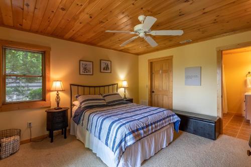 a bedroom with a bed and a ceiling fan at 1 Relaxing Place in Todd