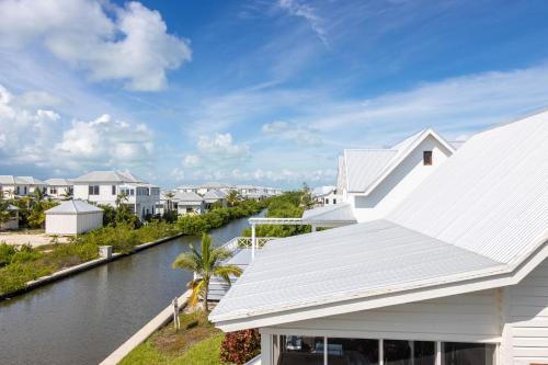 a view of a river from a house at Casa Blanca and The PoolClub at Mahogany Bay in San Pedro