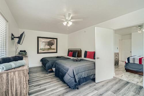 a bedroom with two beds and a ceiling fan at Singer Island Stunner 2 BR in West Palm Beach