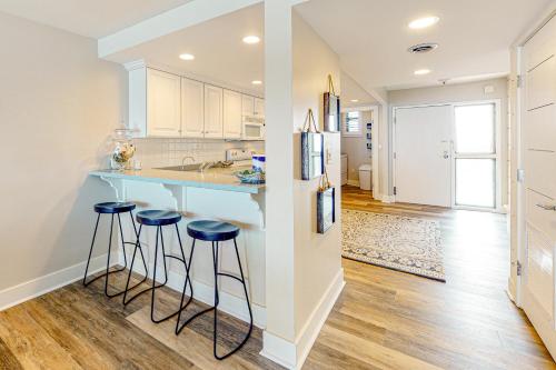 a kitchen with a blue counter and stools in it at Sea Colony Ocean --- 1205N Edgewater House in Bethany Beach