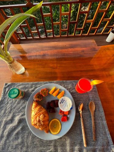 a plate of food on a table with a plate of food at Mountain House Phú Quốc in Phu Quoc