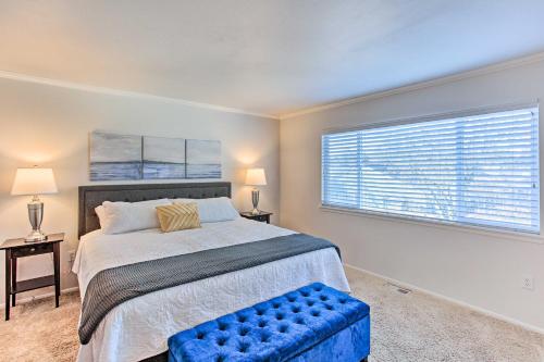 a bedroom with a large bed and a window at Tacoma Home with Garden and Pond about 3 Mi to Beach! in Tacoma