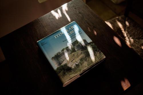 a book sitting on top of a table at Albergo Diffuso Crispolti in Labro Rieti