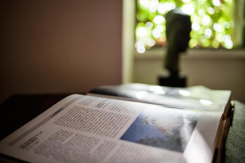a book sitting on top of a table with a window at Albergo Diffuso Crispolti in Labro Rieti